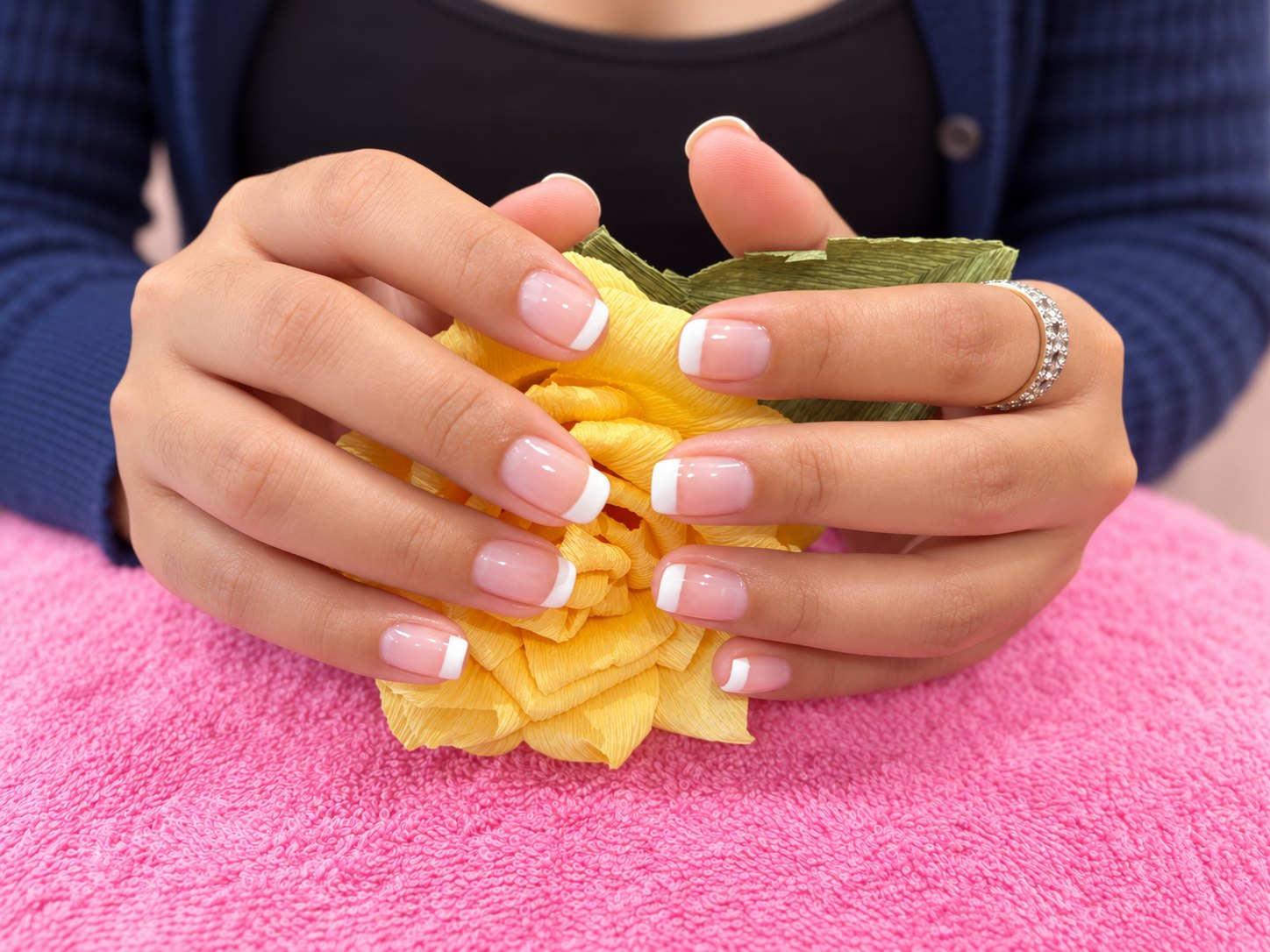 A classic French manicure, finished with care.